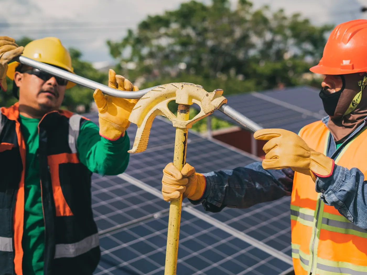 Two installers working together on a solar array